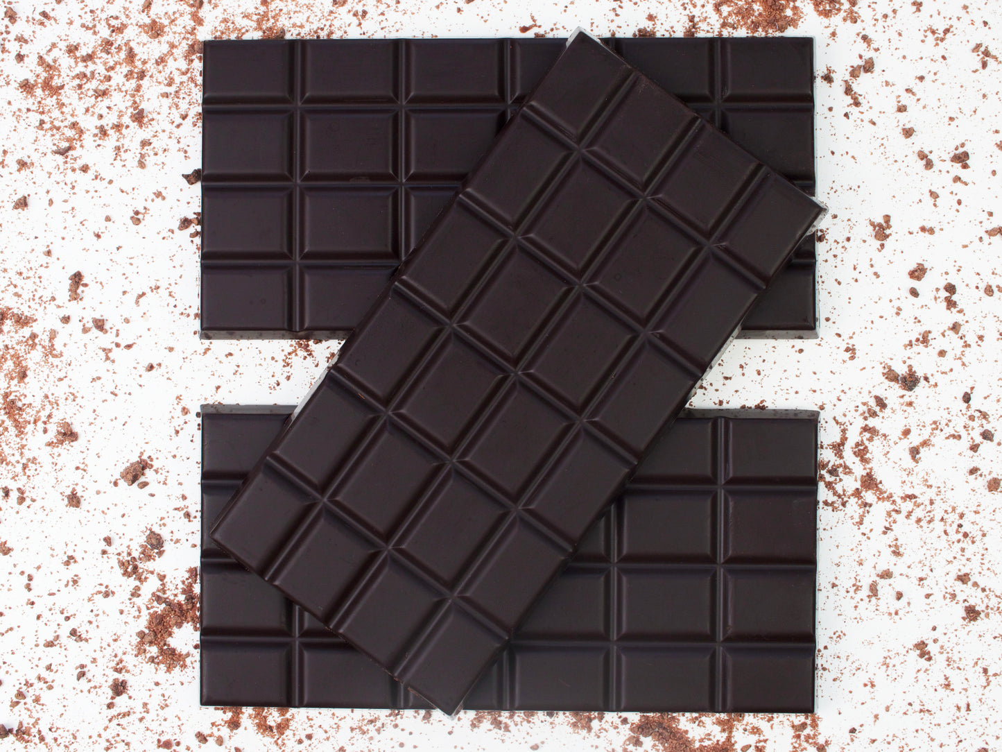 image shows 3, 100g 100% cocoa chocolate bars.