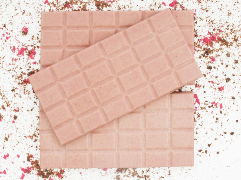 image shows 3, 100g hand made vegan white chocolate and raspberry bars