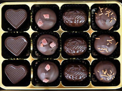 image shows a Box of 12 Vegan alcoholic truffles, champagne, prosecco & strawberry, rhubarb gin, cherry & kirsch.