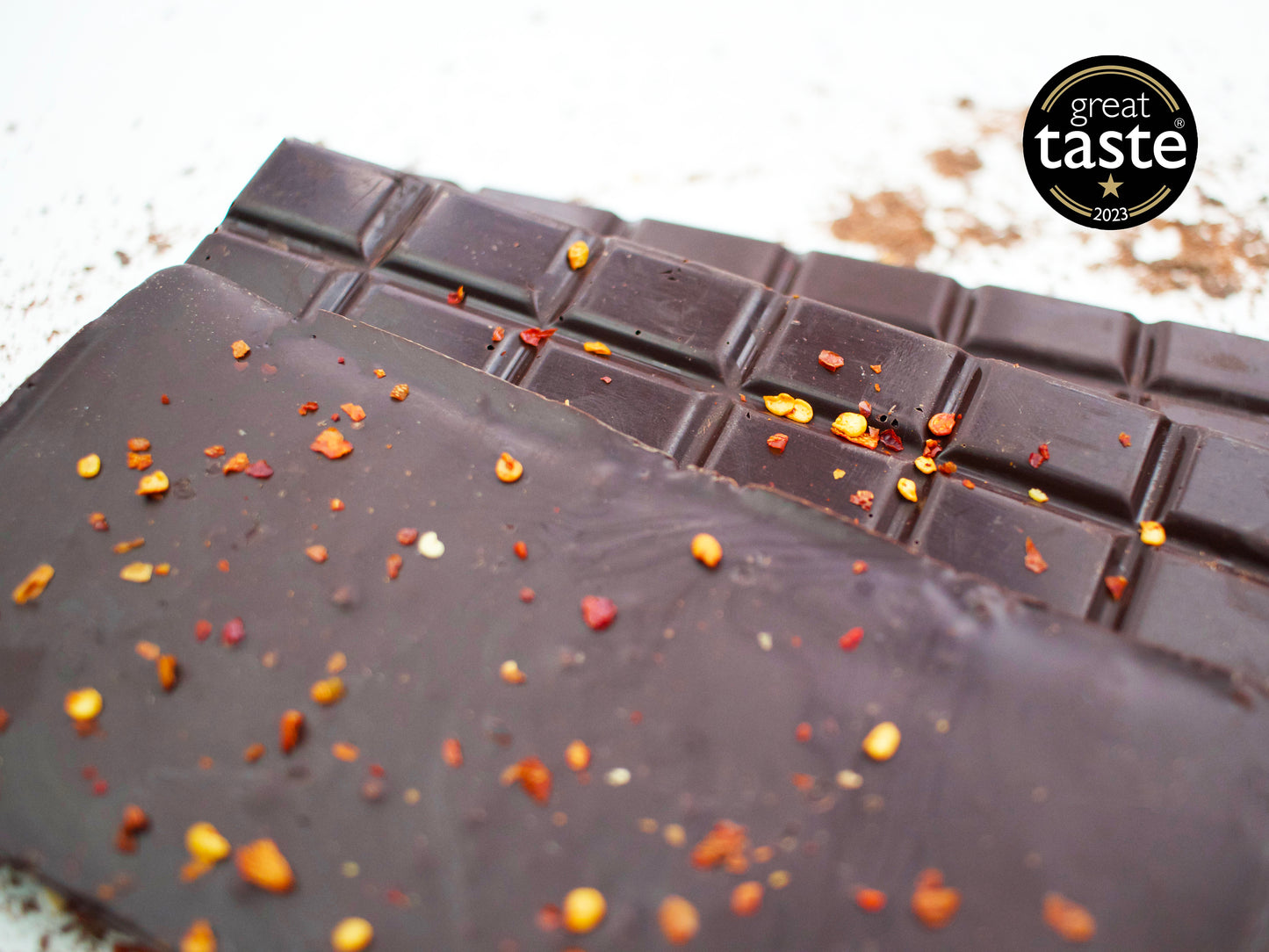Image shows a group of 3, Great Taste gold star winning dark chocolate chilli bars.