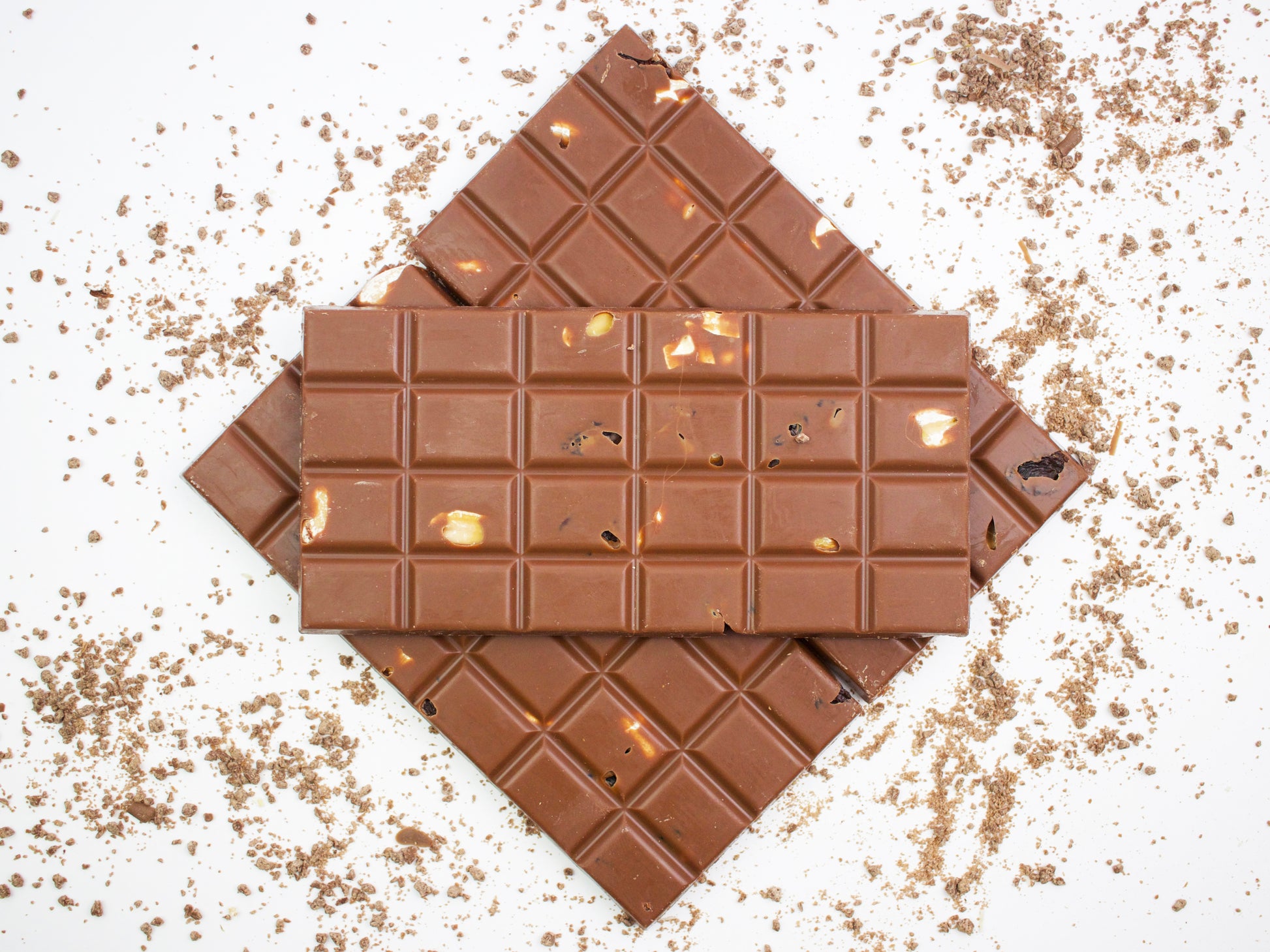 image shows 3, 100g hand made milk chocolate bars embedded with peanuts and raisins