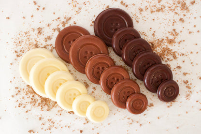 image shows milk, white and dark chocolate sugar free button shaped chocolates.