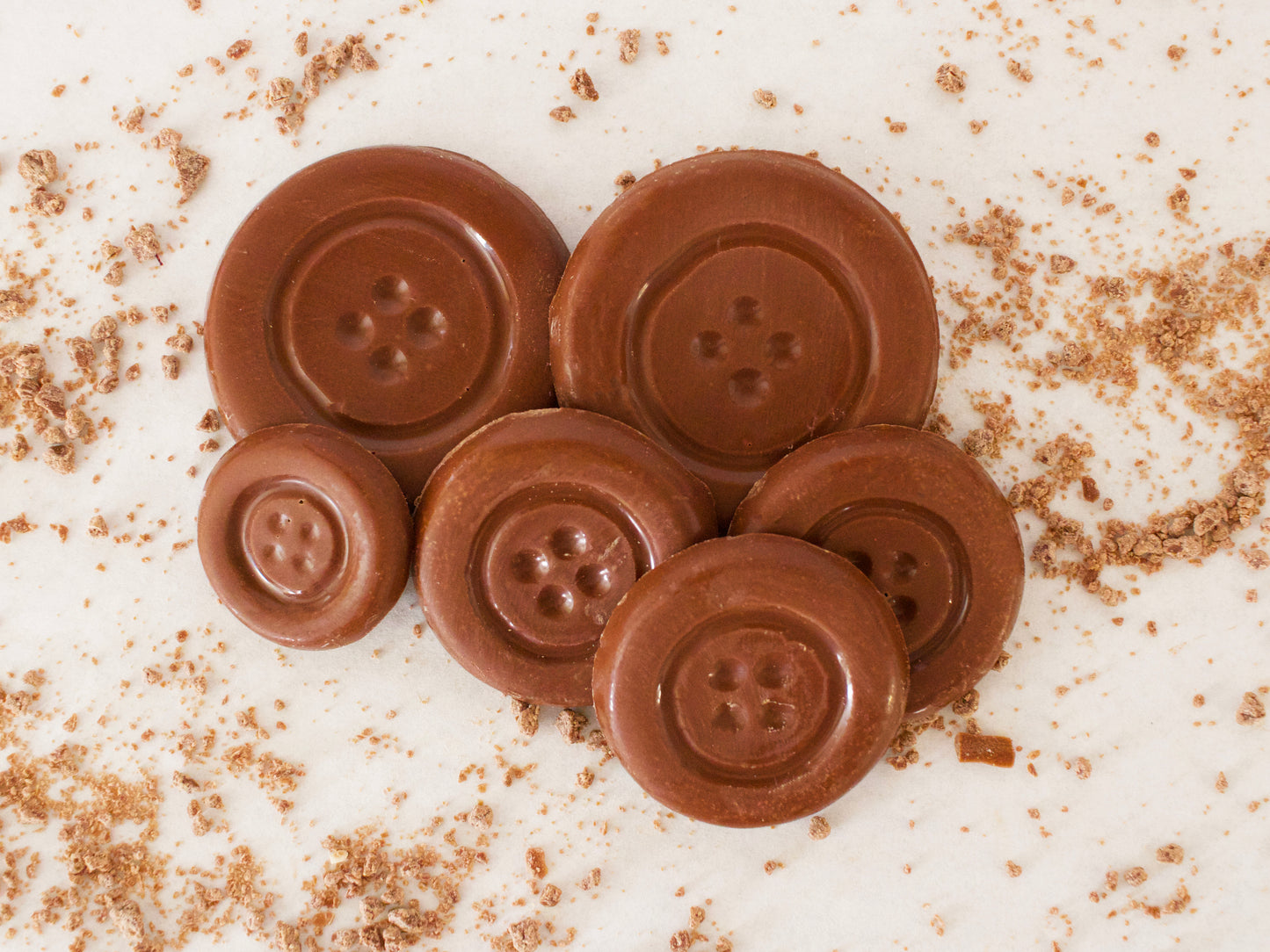 image shows sugar free milk button shaped chocolates.
