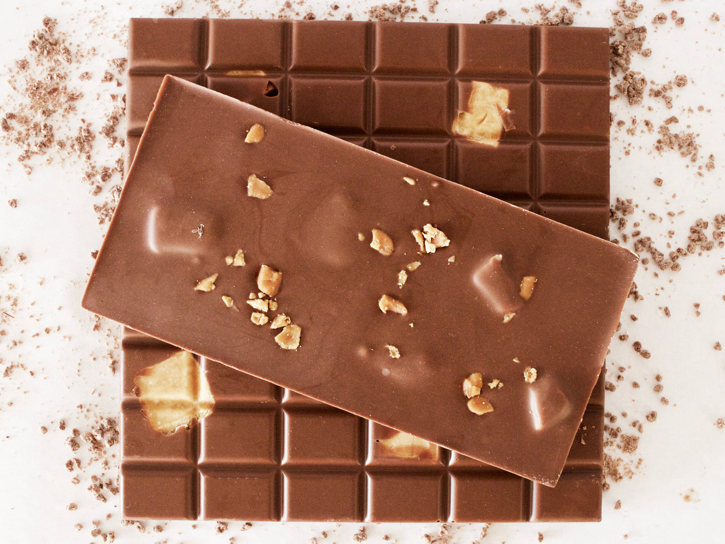 image shows 3, 100g hand made milk chocolate bars embedded with our own recipe vanilla fudge