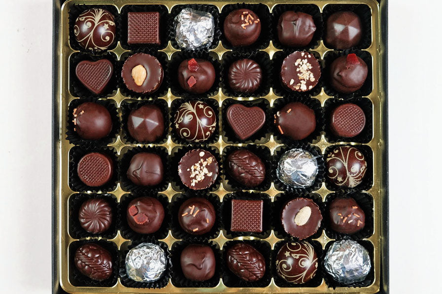 image shows a selection box of 36 vegan chocolates.
