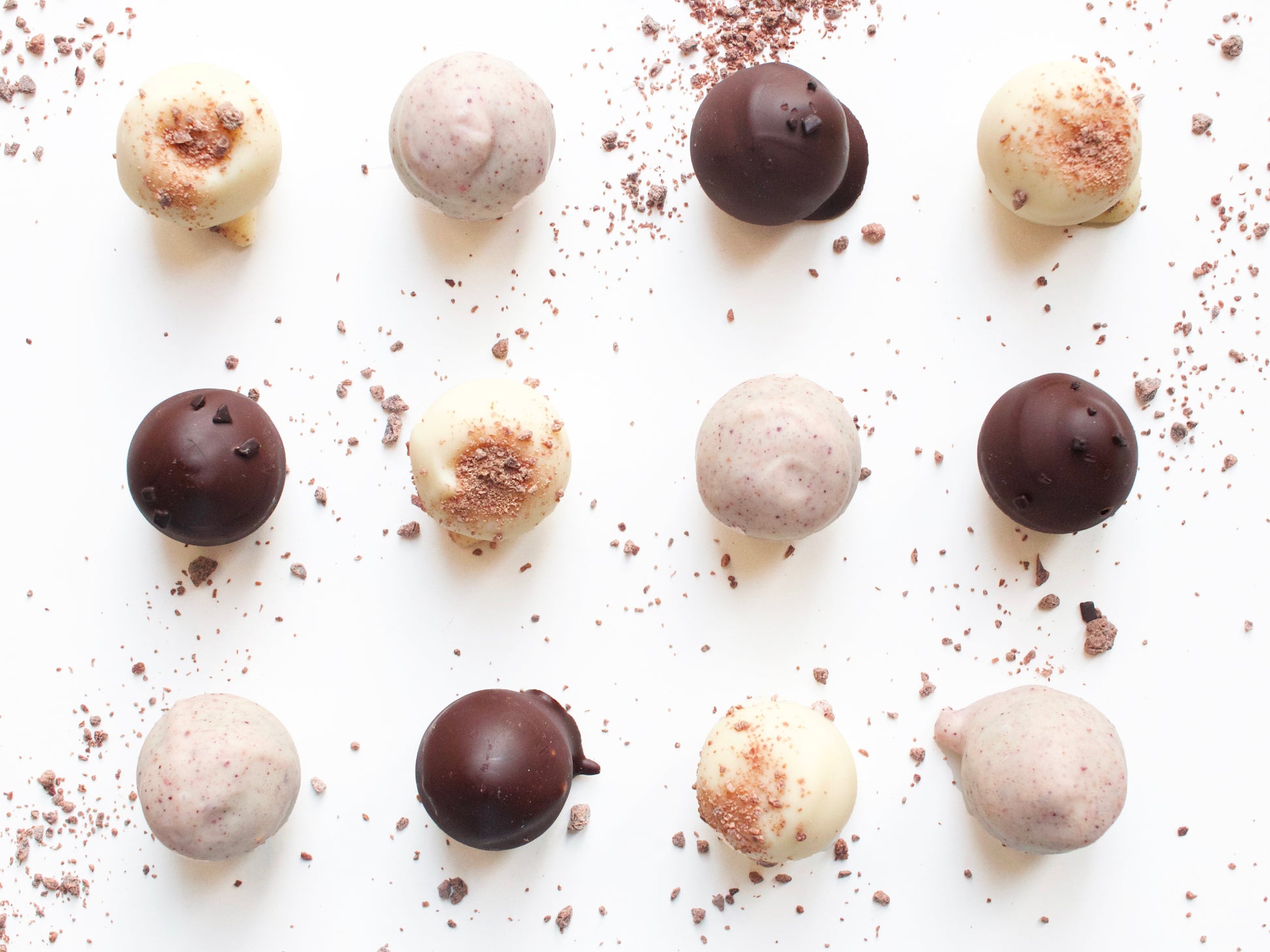 image shows individual  hand made whisky, salted caramel vodka and berry gin truffles
