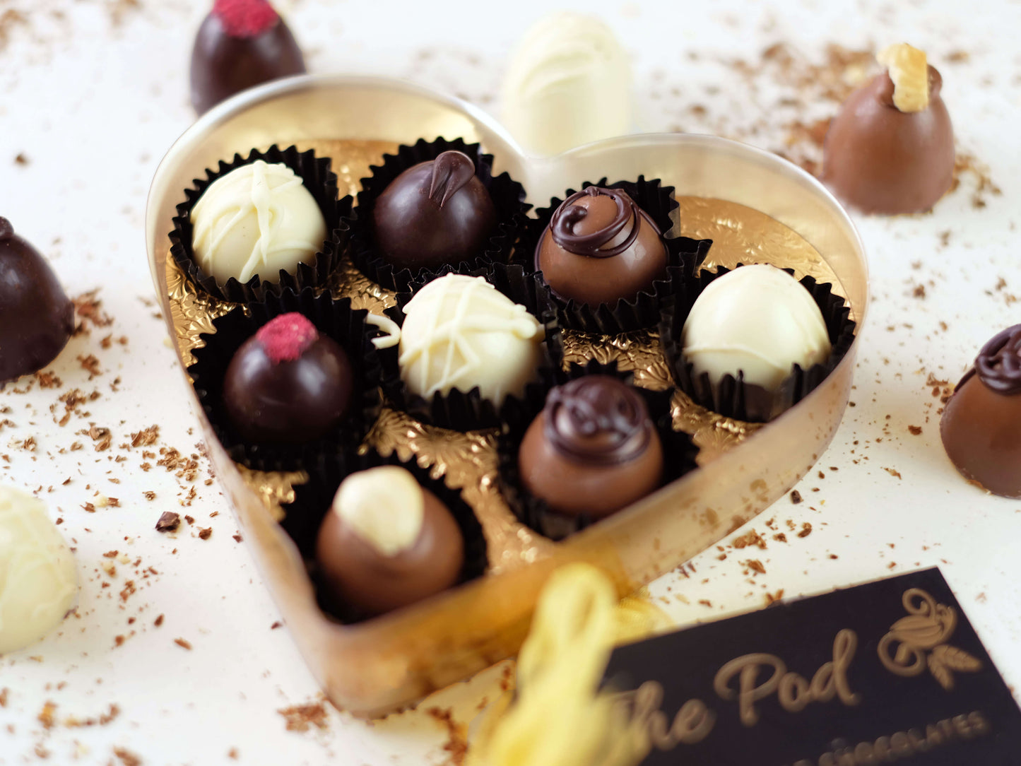 image shows an open heart shaped gift box of 8 sugar free chocolates