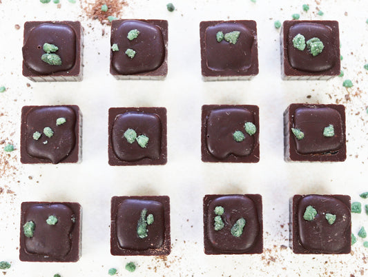 Image shows 12 individual Dark Chocolate hand made Peppermint Creams.