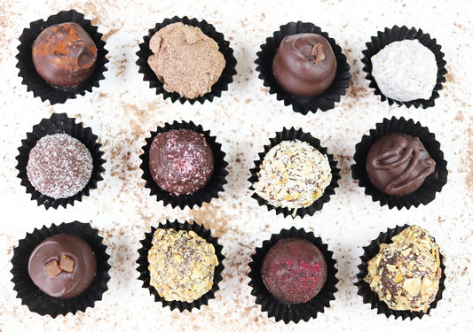  image shows each of the vegan dark chocolate truffles in a selection box