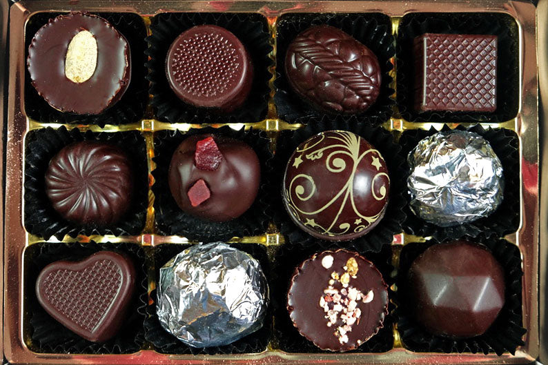 image shows a typical selection in a box of 12 vegan chocolates, chosen from our range of flavours