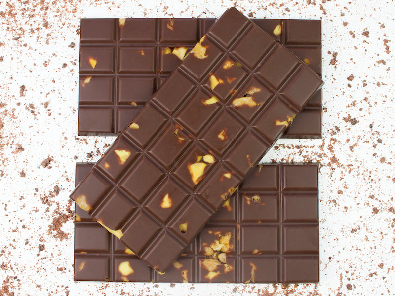 image shows 3, 100g hand made vegan milk chocolate bars embedded with chunks of vegan honeycomb