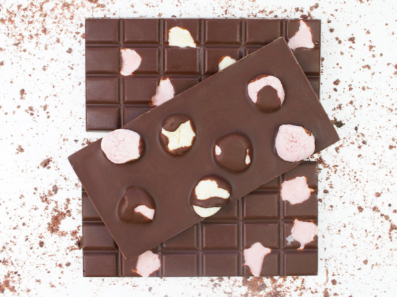 image shows fronts and back of 3, 100g hand made vegan milk chocolate bars embedded with vegan marsh mallows